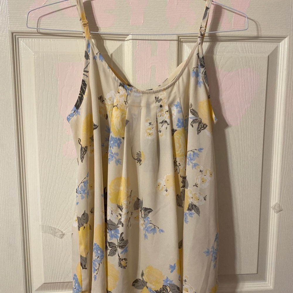 Cream colored tank top with a floral design